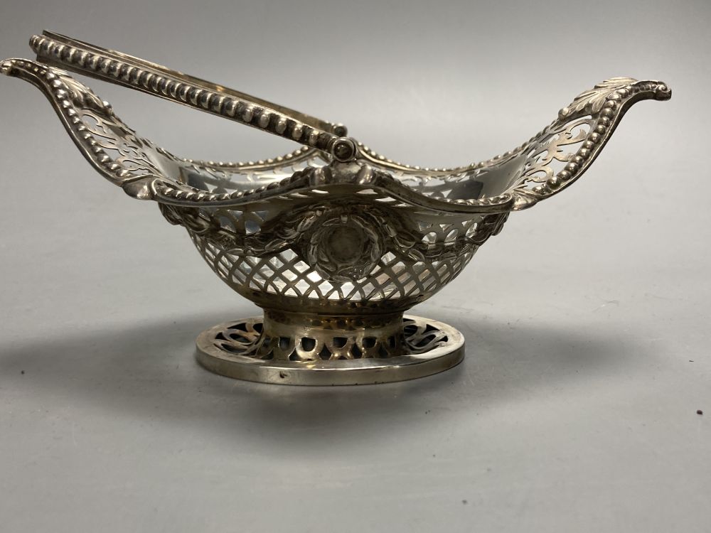 A late Victorian pierced silver boat shaped bonbon basket, Charles Stuart Harris, London, 1890, width 17cm, 7oz.